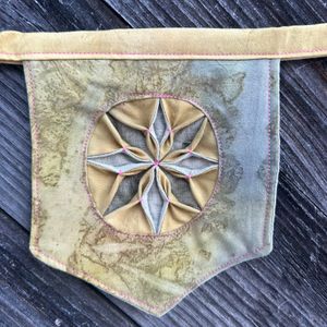 Close up of Green/Yellow star pennant