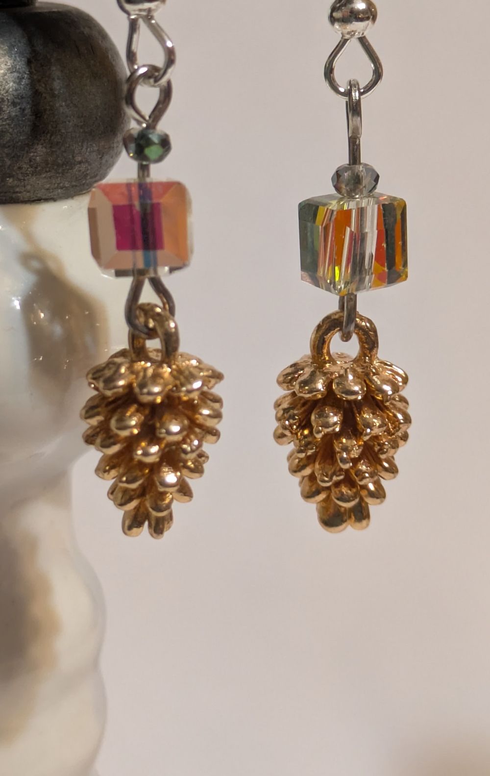 Pinecone dangling earrings; iridescent glass beads