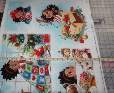 Bea Jackson's Christmas Wonder Panel showing both a measuring tape and cutting mat for size reference