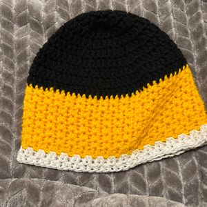 Slouchy beanie with three colors (black, yellow, and white trim)