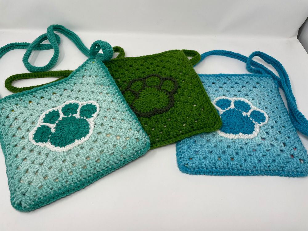 Paw print cross body bag