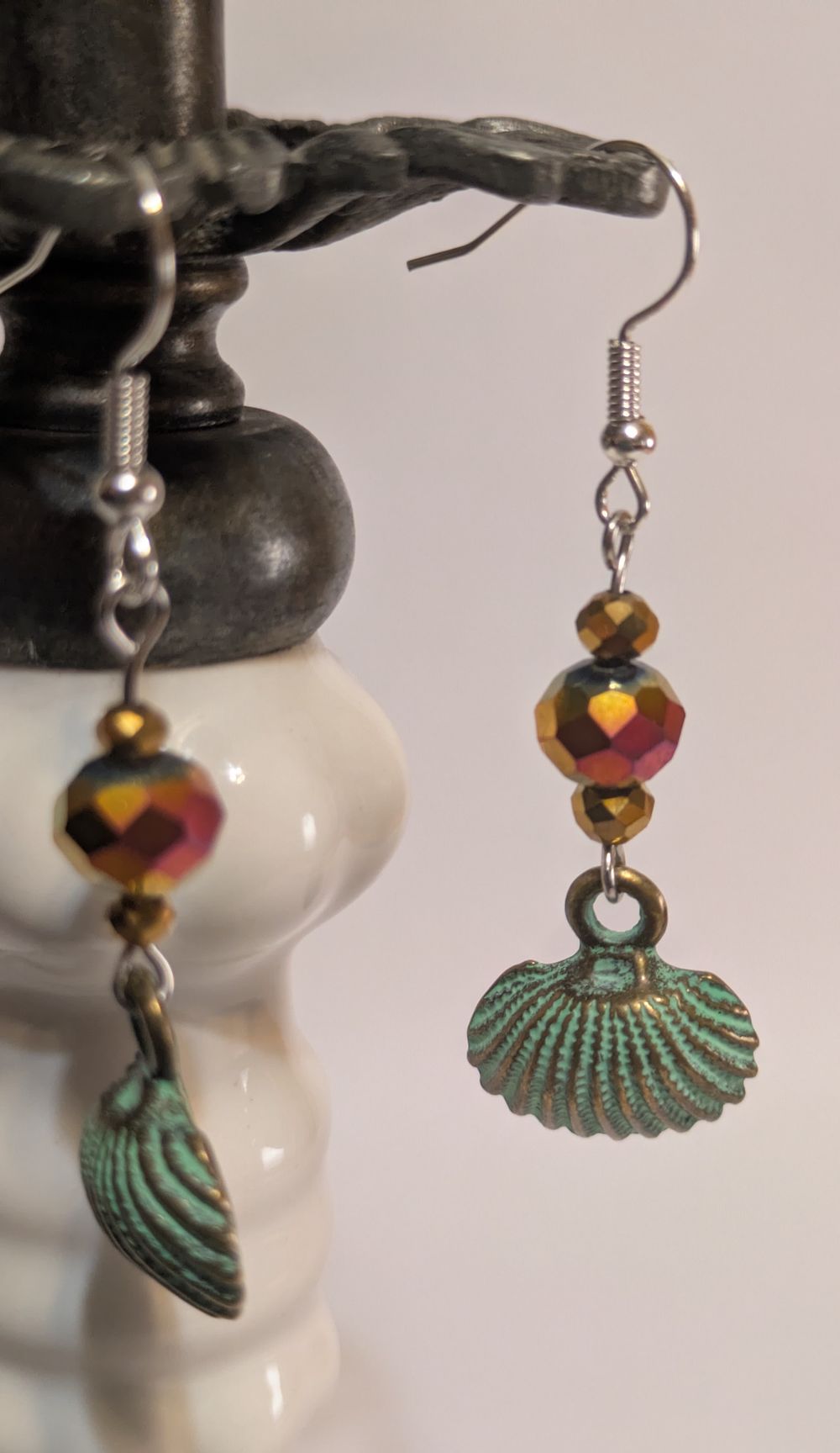 Scallop shell earrings with patina and iridescent gold glass bead accents