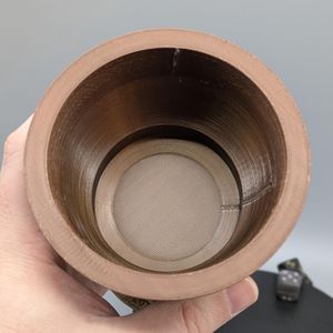 The interior can hold a standard beverage can, or a lot of dice. It is NOT watertight.