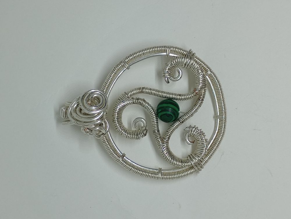 Crystal triskelion pendant 