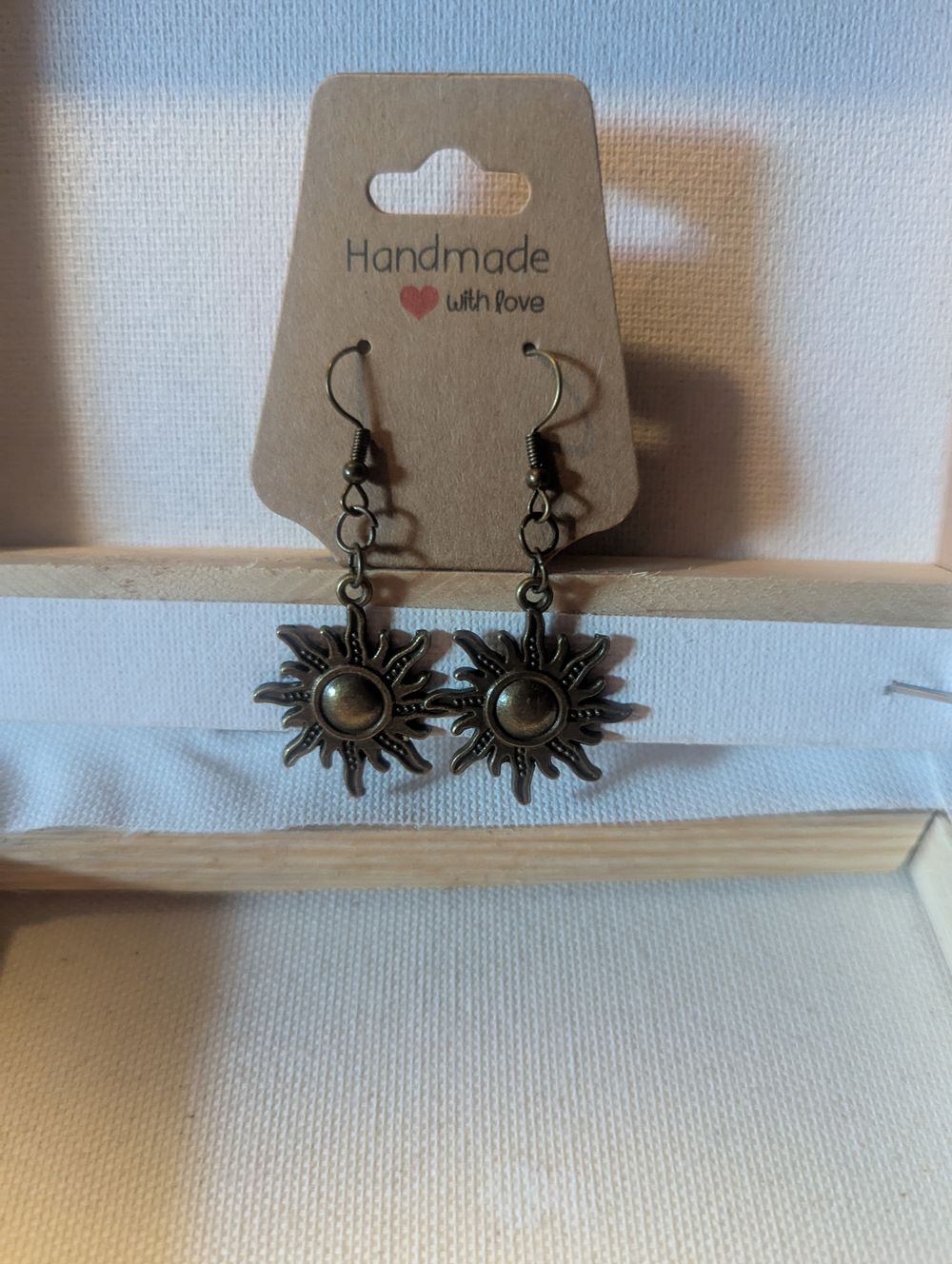 Brassy finish sun earrings 