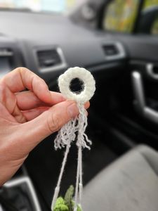 White pot with 3 tones of green leaves
