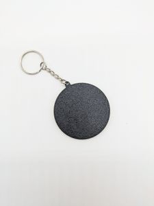 The back of the keyring. It's just a key ring, chain, and a black circle. Very plain, but I had to prove it's not double-sided.
