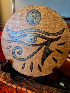 Detail of side picturing the Eye of Ra indoors.