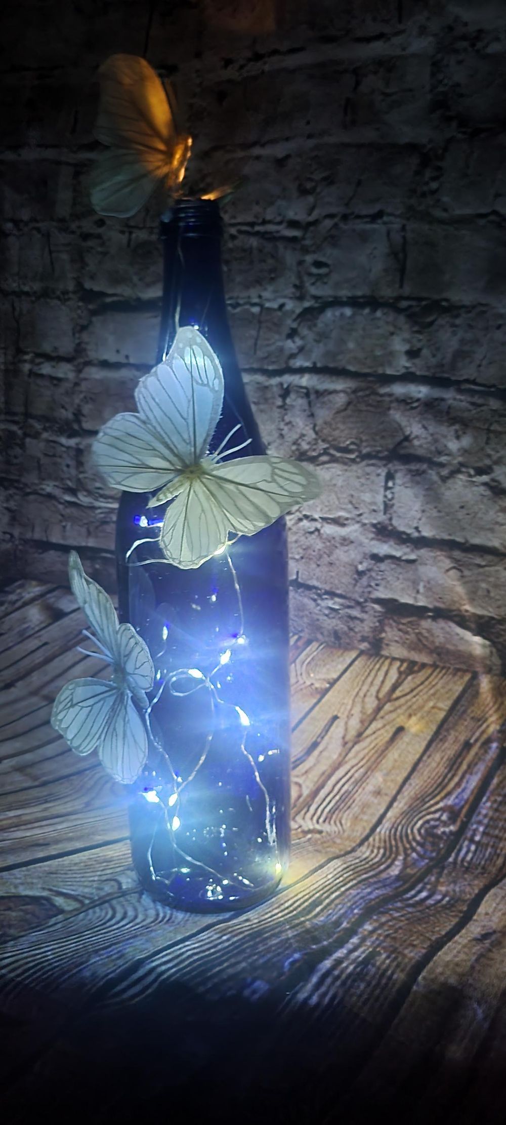 Cobalt blue wine bottle electric LED lights with white butte...