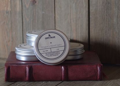 Dragon's Blood Salve in a tin