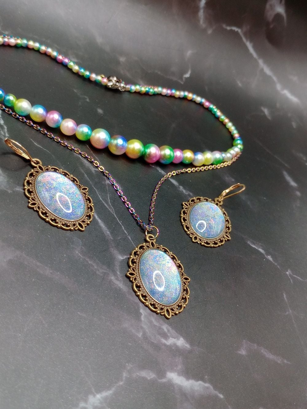 Vintage style dark gold color pendant earrings and imitation...