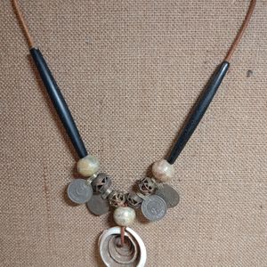 Tribal coin and shell 