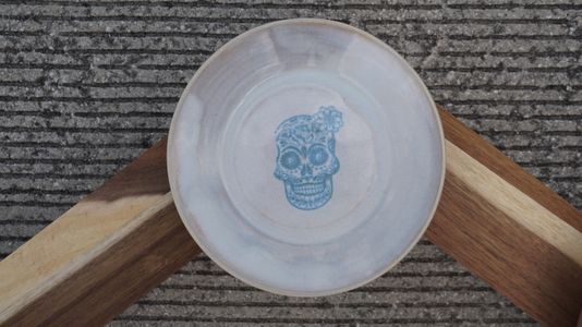 Catrina Skull covered with opal glaze to prevent fading 