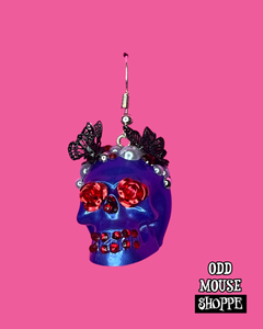 A side view of the skull earring