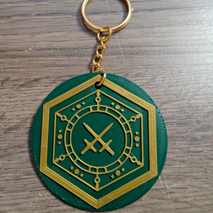 Close up of the House Veridian keychain