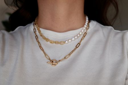 Dawn citrine and pearl necklace shown worn layered with a gold paperclip chain necklace