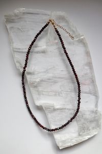 The Brenna Necklace made of micro faceted garnet beads with gold-filled clasp and extender