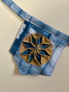 Blue/Yellow star pennant close up 