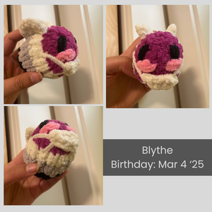 A collage of images of Blythe the knitted bee. Blythe is striped in ace pride flag colors, with the purple stripe forming their face. They are wearing a knitted mask to show community care against Covid. There is pink blush embroidered on their cheeks.
