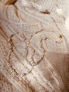 The Lilac Mist Pearl necklace variants in sunlight