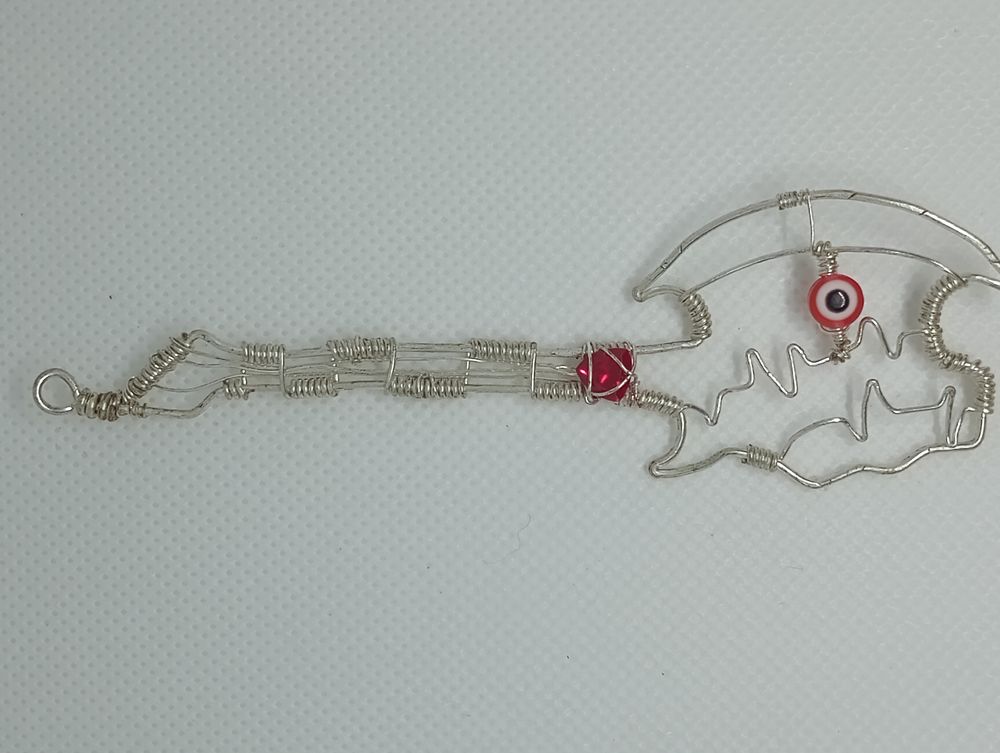 Wire wrapped demon axe bass pendent 