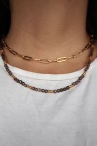 Smoky quartz and gold Mira Necklace worn layered with a gold paperclip necklace.