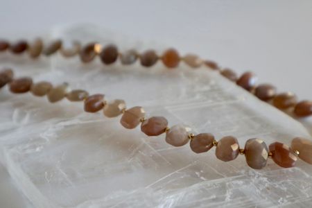 Closer look at the faceted peach moonstone beads.