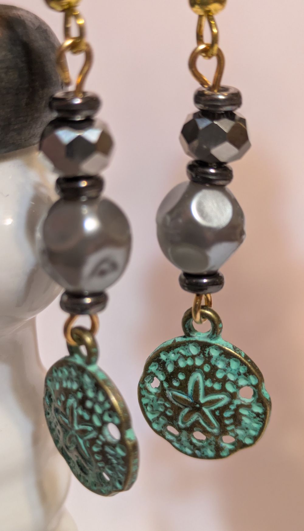 Patina sand dollar earrings with vintage faux black pearl bead accents