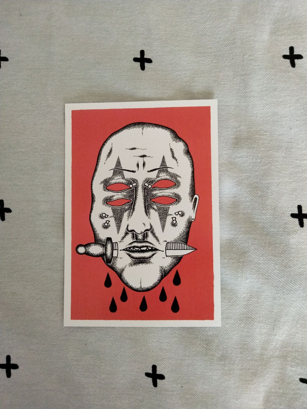 Face with dagger print