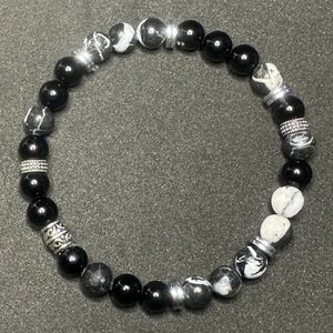 8", ebony blackwood, zebra jasper, and hematite with base metal spacers