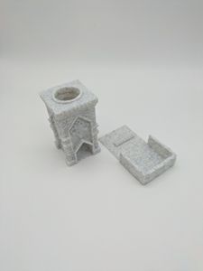 A smaller 3D printed dice tower. It looks like a square, flat roofed tower, and it's printed in a marble-like filament. This image shows how the catch tray can slide out from the bottom of the tower.
