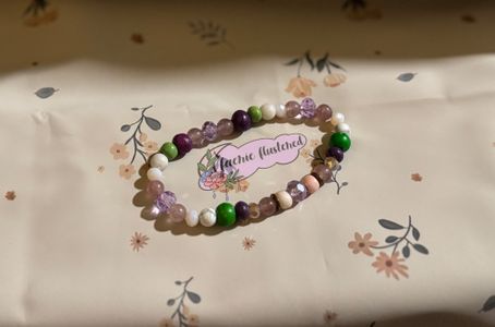 Floral- pink, purple, green, white, and gray beads.