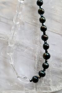 The clear quartz and hematite beads paired with the peacock black freshwater pearls on the Tashira Necklace